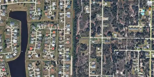 Image 2: Aerial View. Illustrating the property's location relative to surrounding land parcels and infrastructure