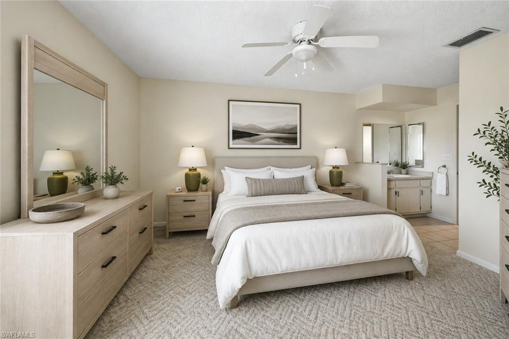 Image 3: Bedroom featuring neutral wall colors, patterned carpeting, and a ceiling fan