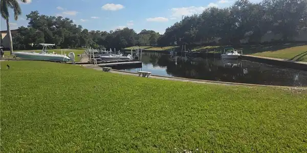 Image 3: Dock with yard and a canal view