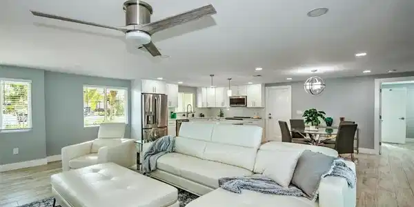 Image 4: Living room with sink, ceiling fan, and light hardwood / wood-style flooring