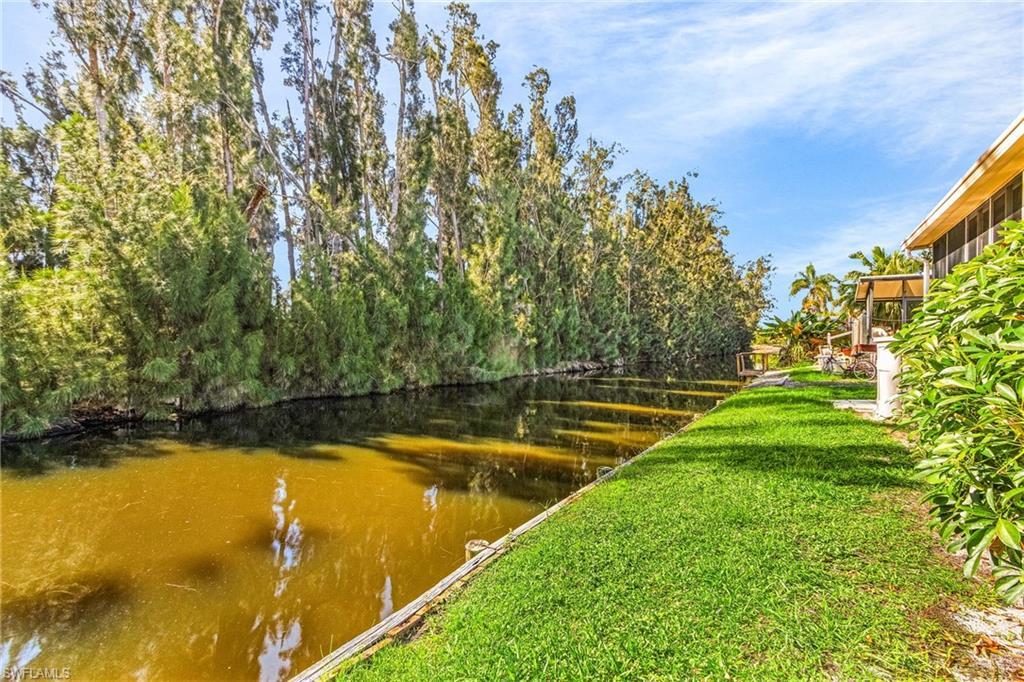 Image 4: View of yard with a water view