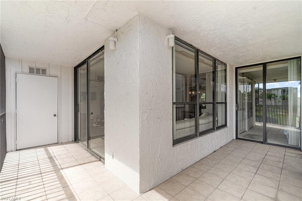 Image 3: View to interior from balcony. Door on left is storage room.