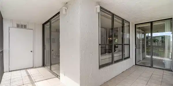 Image 3: View to interior from balcony. Door on left is storage room.