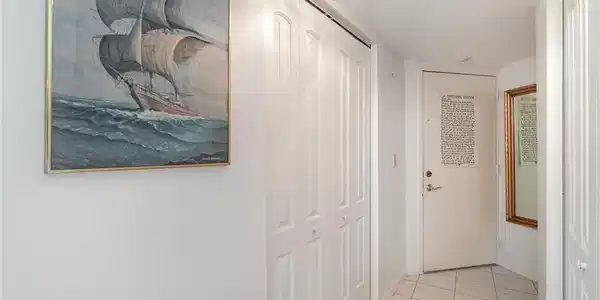 Image 4: Foyer is cleverly configured to include utility and storage closets