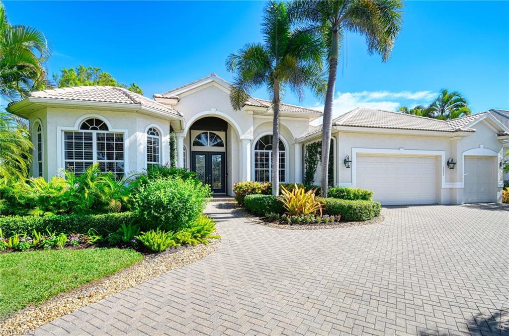 Image 3: Mediterranean / spanish-style home featuring french doors, an attached garage, decorative driveway, a tile roof, and stucco siding