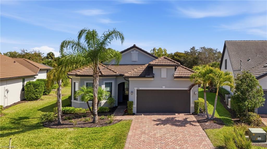 Image 1: Front elevation with manicured landscaping and fresh exterior presentation