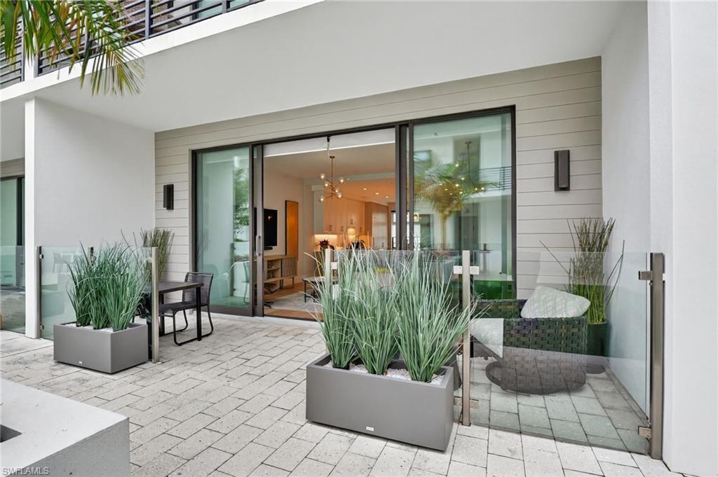 Image 1: View of patio with outdoor dining space