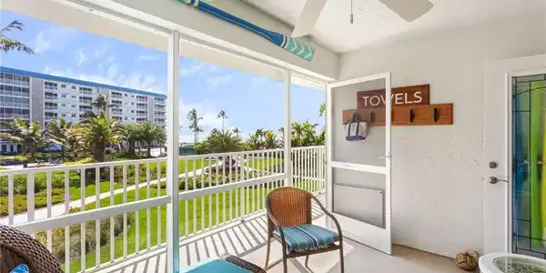 Image 2: Front Screened Balcony with Beautiful Beach views!