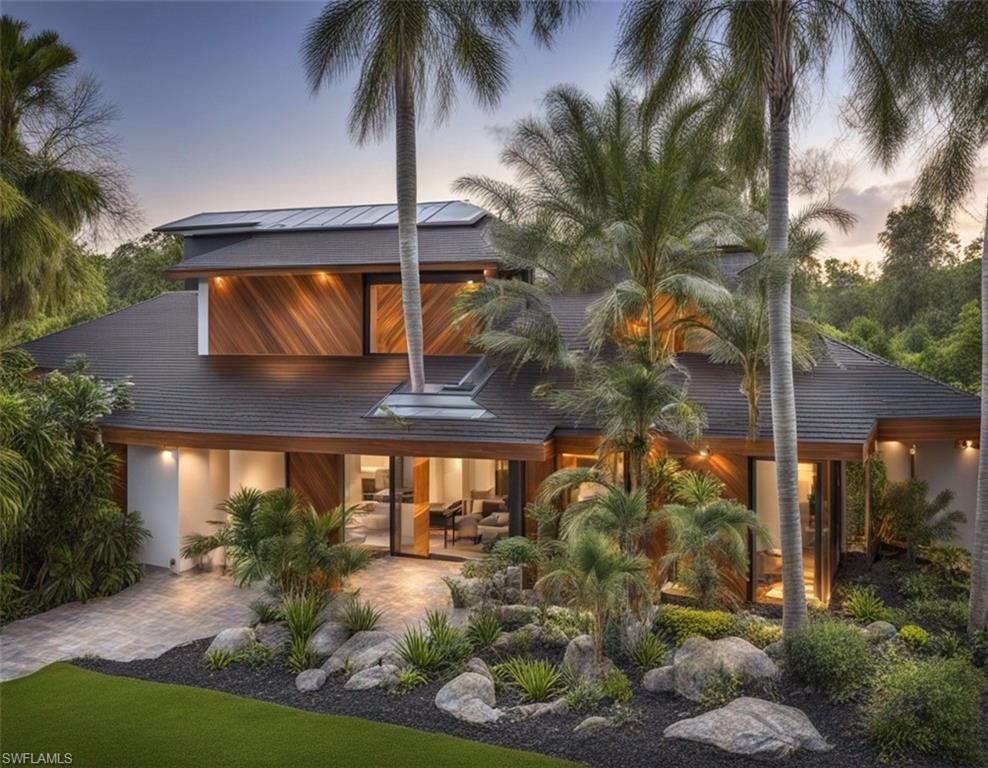 Image 1: Digital Rendering Back of house at dusk featuring a patio