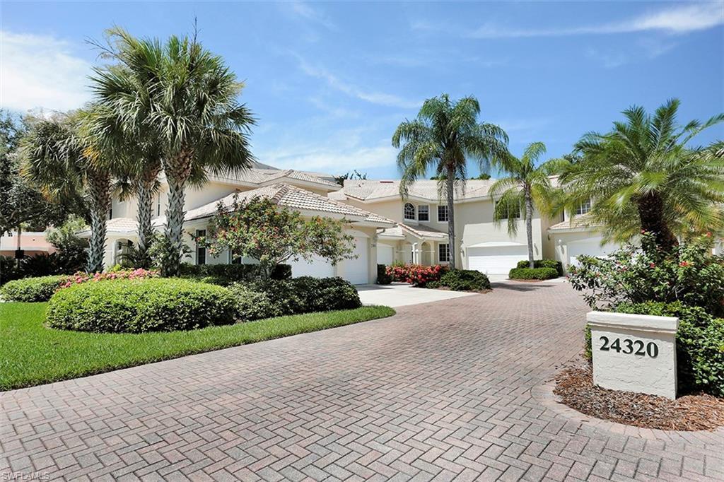 Image 2: View of front of home featuring decorative driveway, an attached garage, and stucco siding