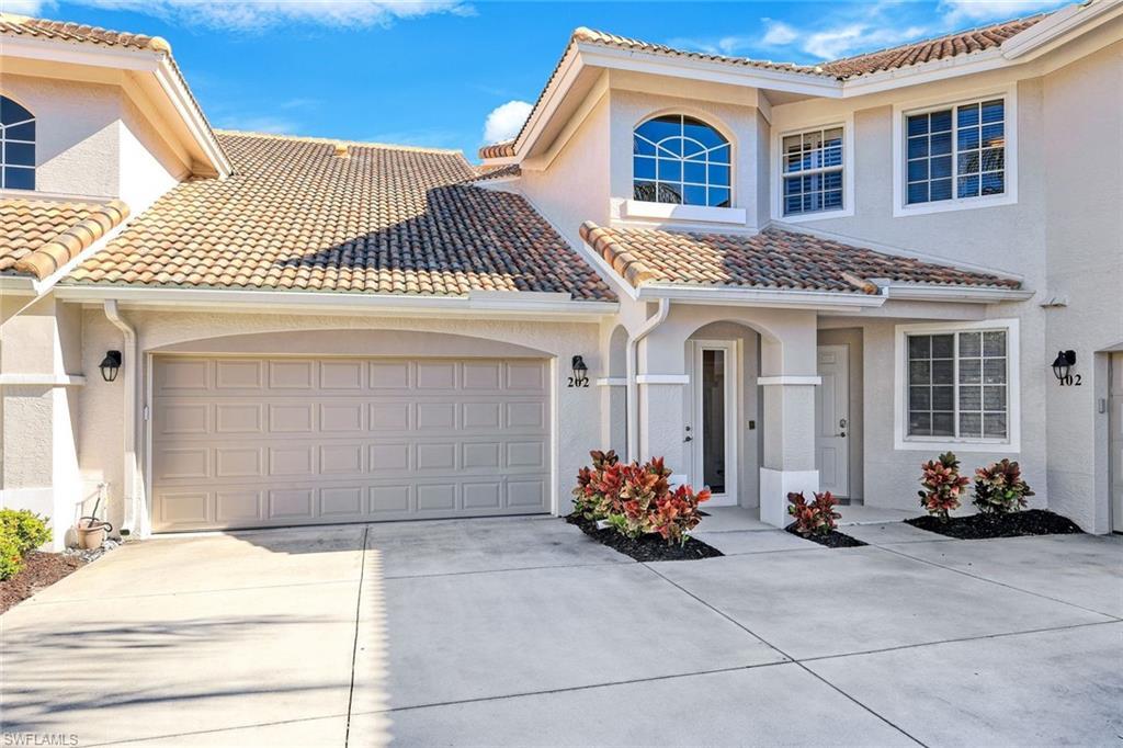 Image 4: Mediterranean / spanish house with stucco siding, concrete driveway, a garage, and a tile roof
