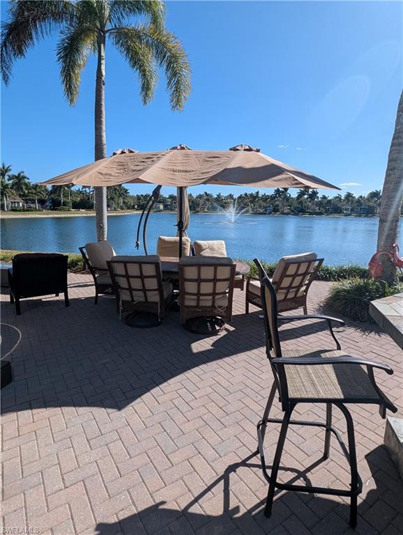 Image 1: View of patio with a water view