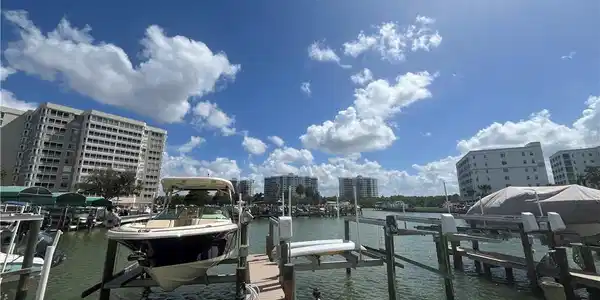 Image 3: Dock area with boat lift and a water view