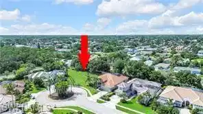 Image 1: Aerial perspective of suburban area