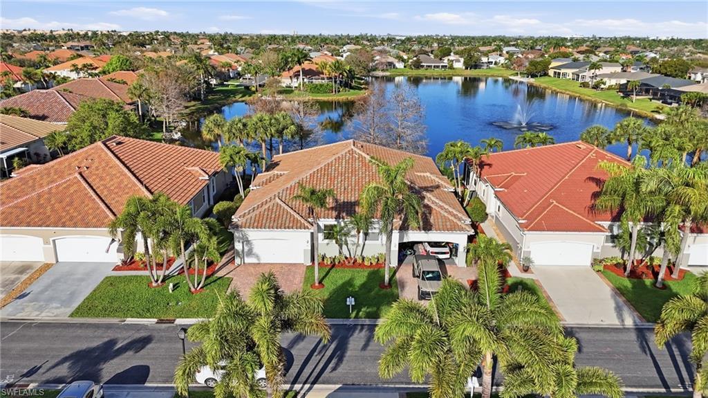 Image 3: Aerial perspective of suburban area with a large body of water - Virtually Edited Image
