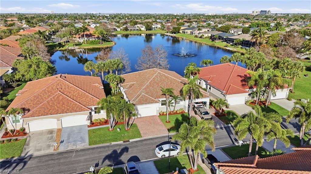 Image 4: Aerial view of residential area with a large body of water - Virtually Edited Image