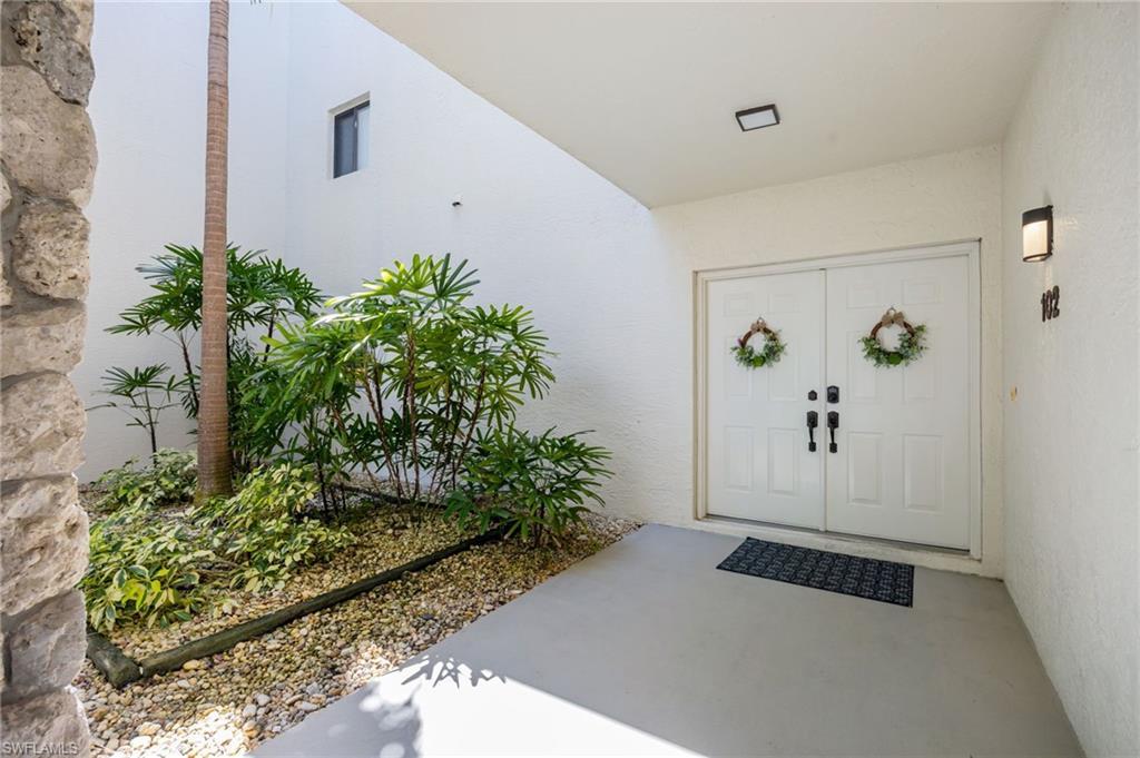 Image 4: Doorway to property with stucco siding