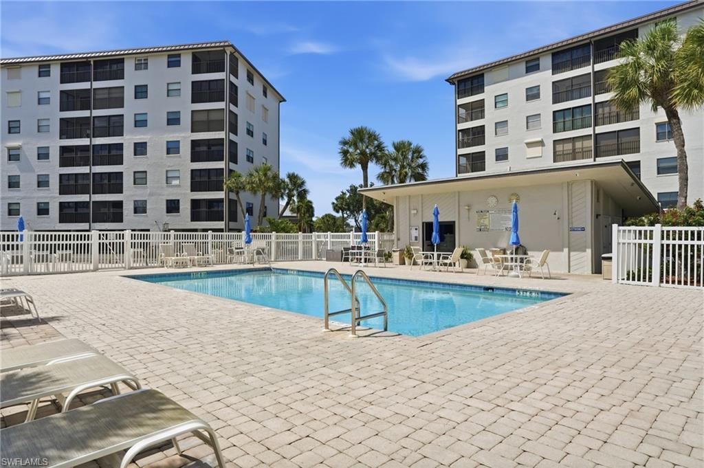 Image 4: Outdoor swimming pool with integrated steps, surrounded by a paver deck - Virtually Edited Image