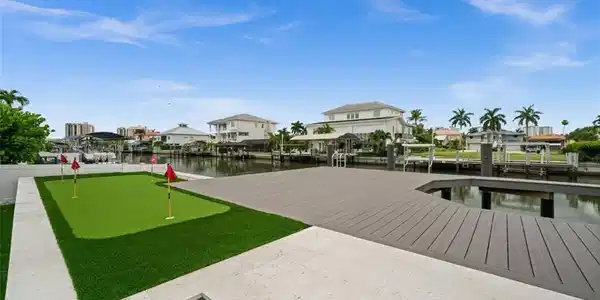 Image 4: putting green overlooking the gulf access canal