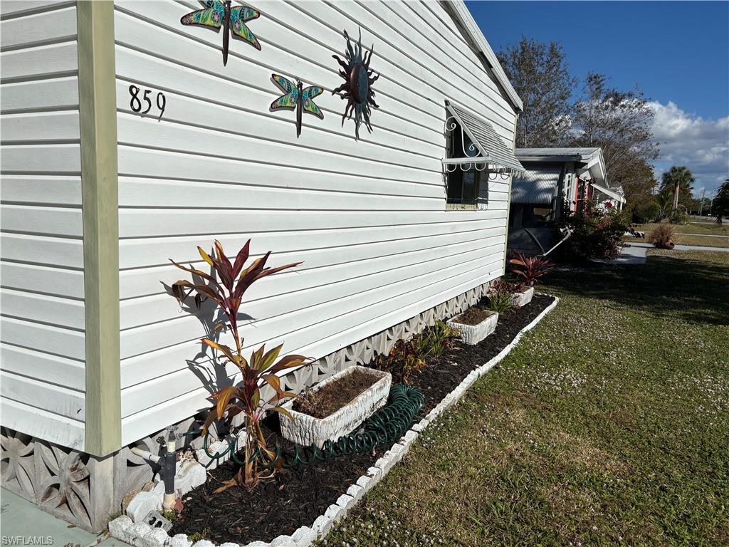 Image 3: View of home's exterior with a yard