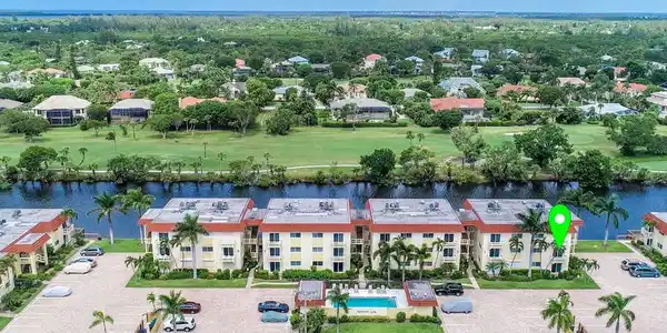 Image 2: Drone / aerial view of a golf club and a large body of water