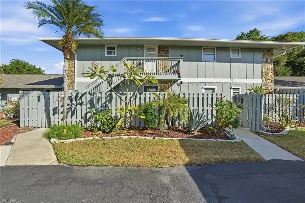 Image 1: View of front of condo , stairway, and a balcony
