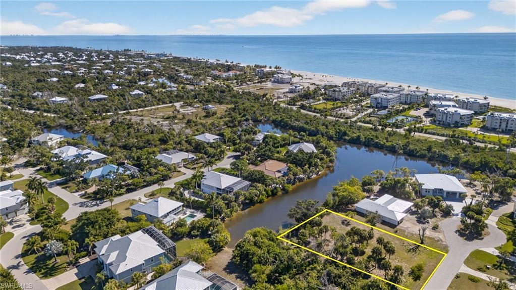 Image 1: Aerial view of waterfront lot and proximity to the beach