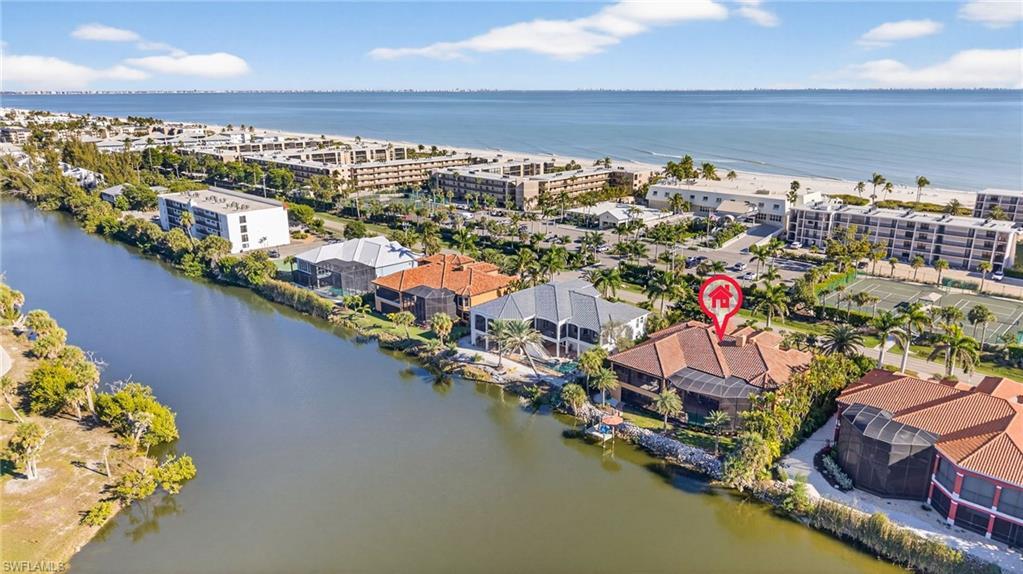 Image 2: Bird's eye view of a large body of water and apartment complex