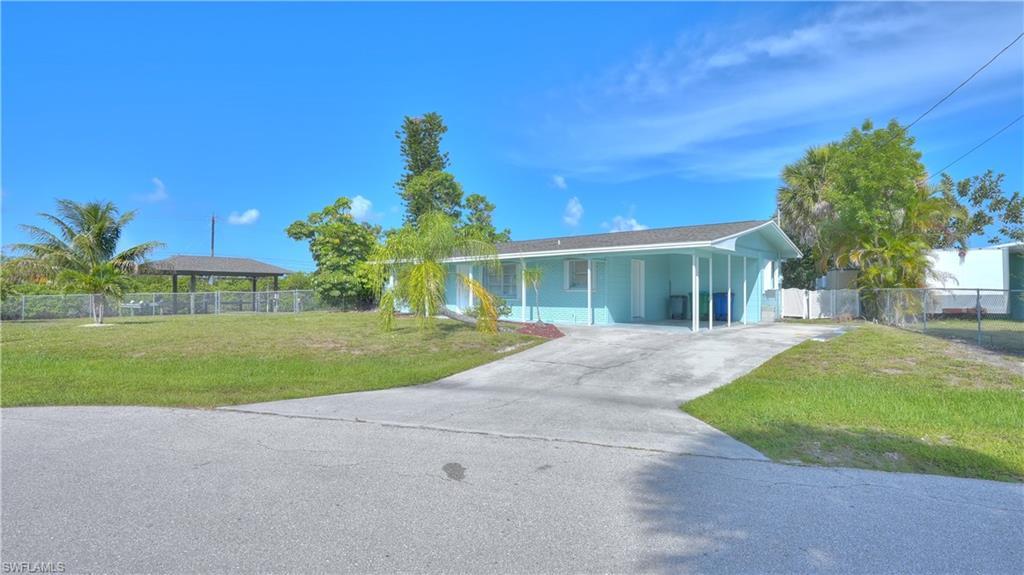 Image 1: Light blue exterior with white trim