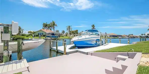 Image 2: Two docks with Trex deck, larger dock with wrap around decking. 16,000 lb. and 5,000 lb lifts.