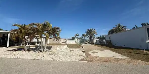 Image 2: Community pool featuring a patio