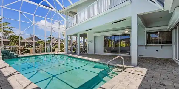 Image 3: Swimming pool with a patio, a sunroom, a lanai, and a balcony