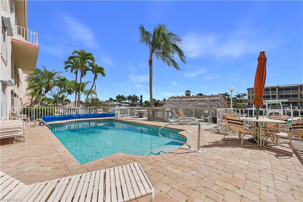 Image 4: View of heated pool featuring large patio surround