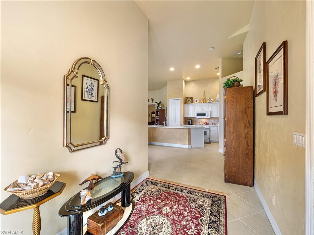 Image 4: Hallway featuring light tile patterned flooring and recessed lighting