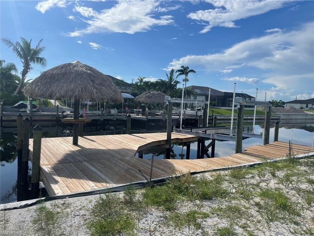 Image 1: Dock area featuring a water view and boat lift