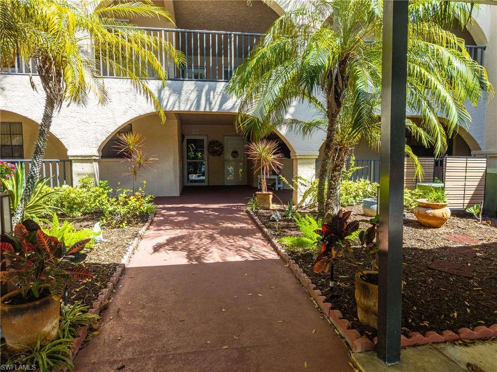 Image 3: Entrance to property with stucco siding