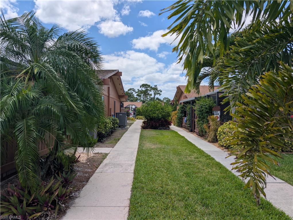 Image 3: Walkway from parking to unit and pool.