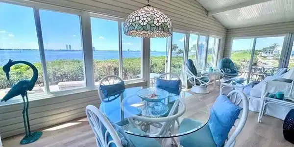 Image 4: Sunroom with sliding windows and River view