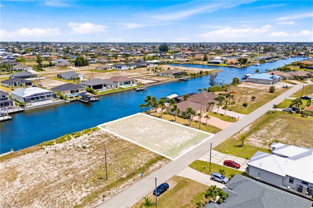 Image 3: Canal-front lot with direct water access