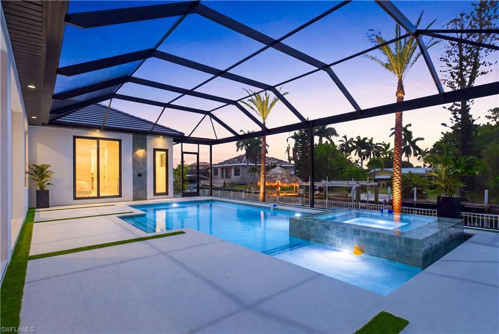 Image 3: HIGH-END FINISHES, STUNNING CANAL VIEWS, UNMATCHED BOATING ACCESS & YEAR-ROUND RESORT-STYLE LIVING!