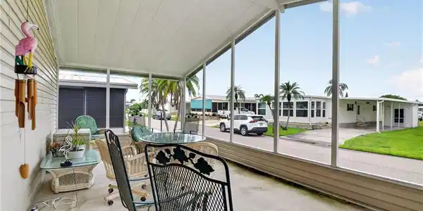 Image 4: Screened porch featuring a solid roof and concrete flooring