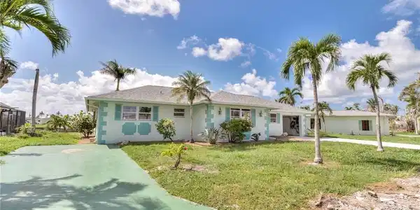 Image 3: Front of house showing RV or addition car parking