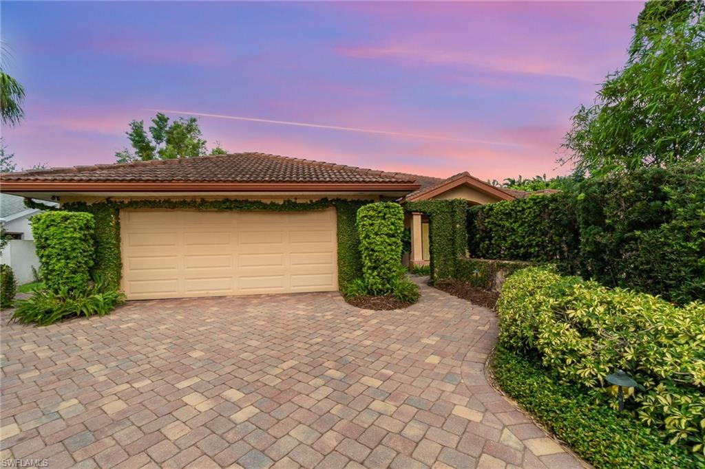 Image 2: View of front of home featuring a garage