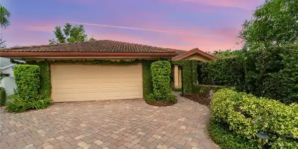 Image 2: View of front of home featuring a garage