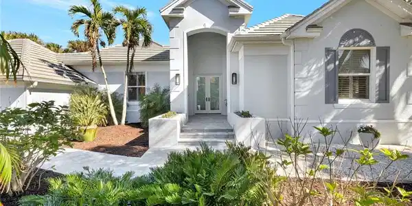 Image 2: View of front of house featuring french doors