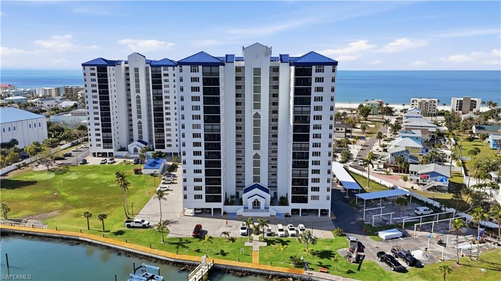 Image 2: Aerial view of a large body of water and apartment complex / building - Virtually Edited Image