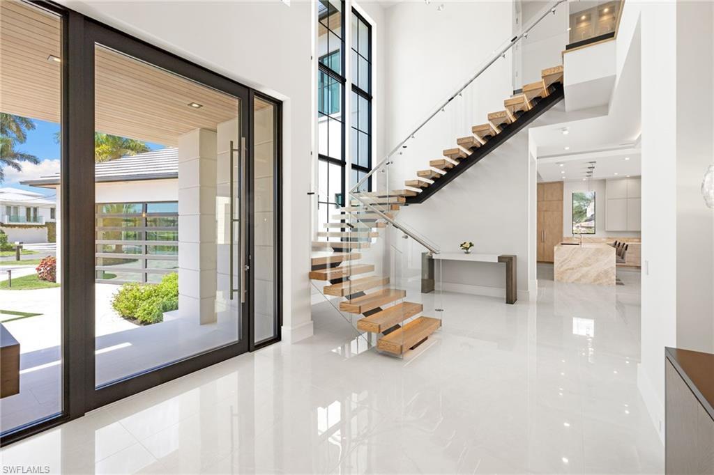 Image 3: Foyer with a high ceiling and recessed lighting
