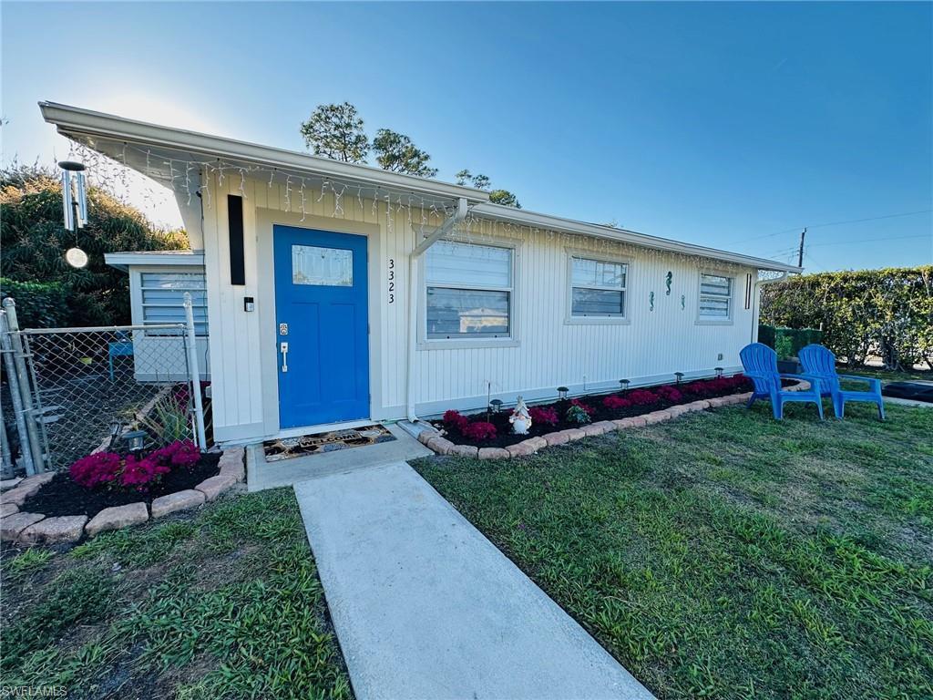 Image 1: Front of home, new landscaping