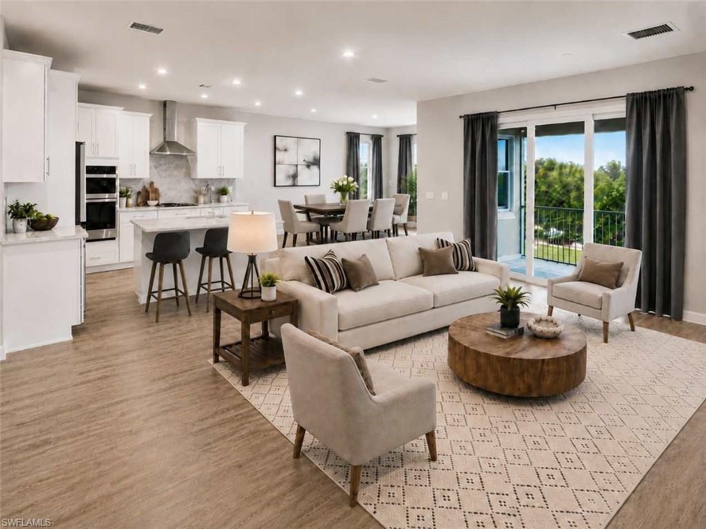 Image 1: Photo includes reality staging to showcase the possibility of the kitchen/living/dining room. Design services included with purchase!