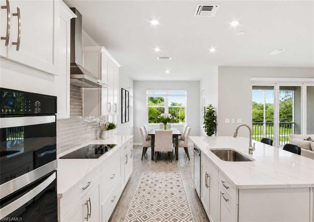 Image 2: Photo includes reality staging to showcase the possibility of the kitchen. Design services included with purchase!